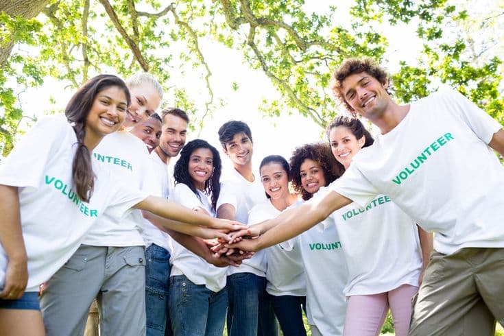 Volunteers working with children